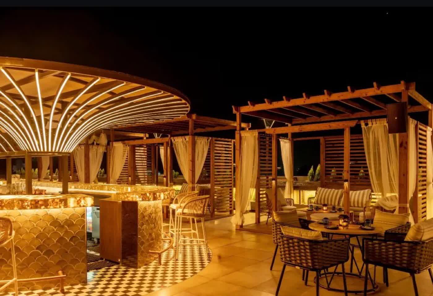 Golden lit bar canopy at Farzi Café Dehradun