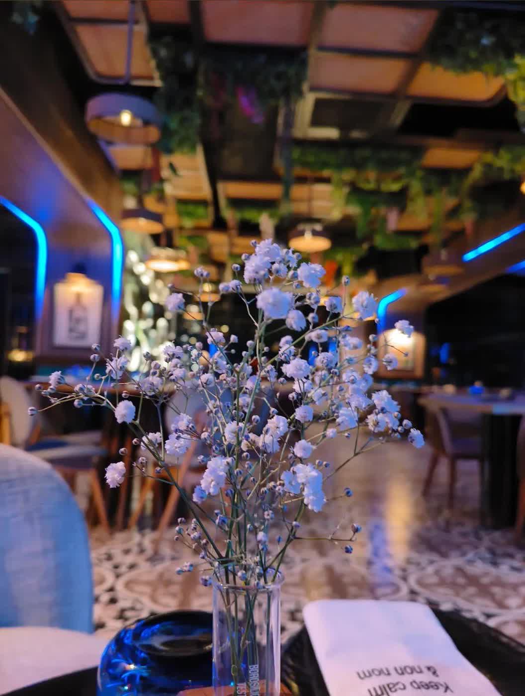 Interior with baby's breath florals and blue mood lighting