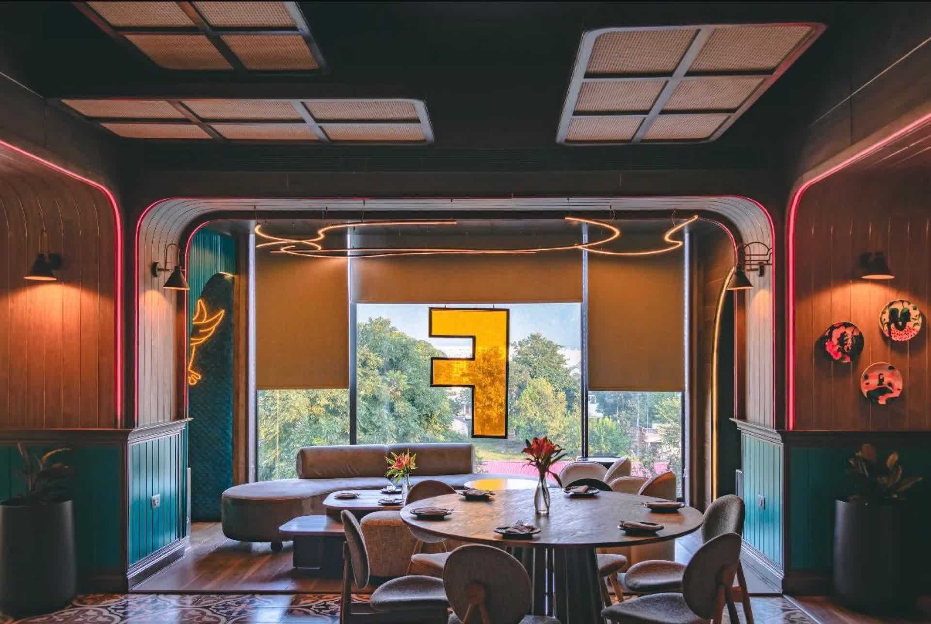 Interior dining hall with neon Farzi F logo