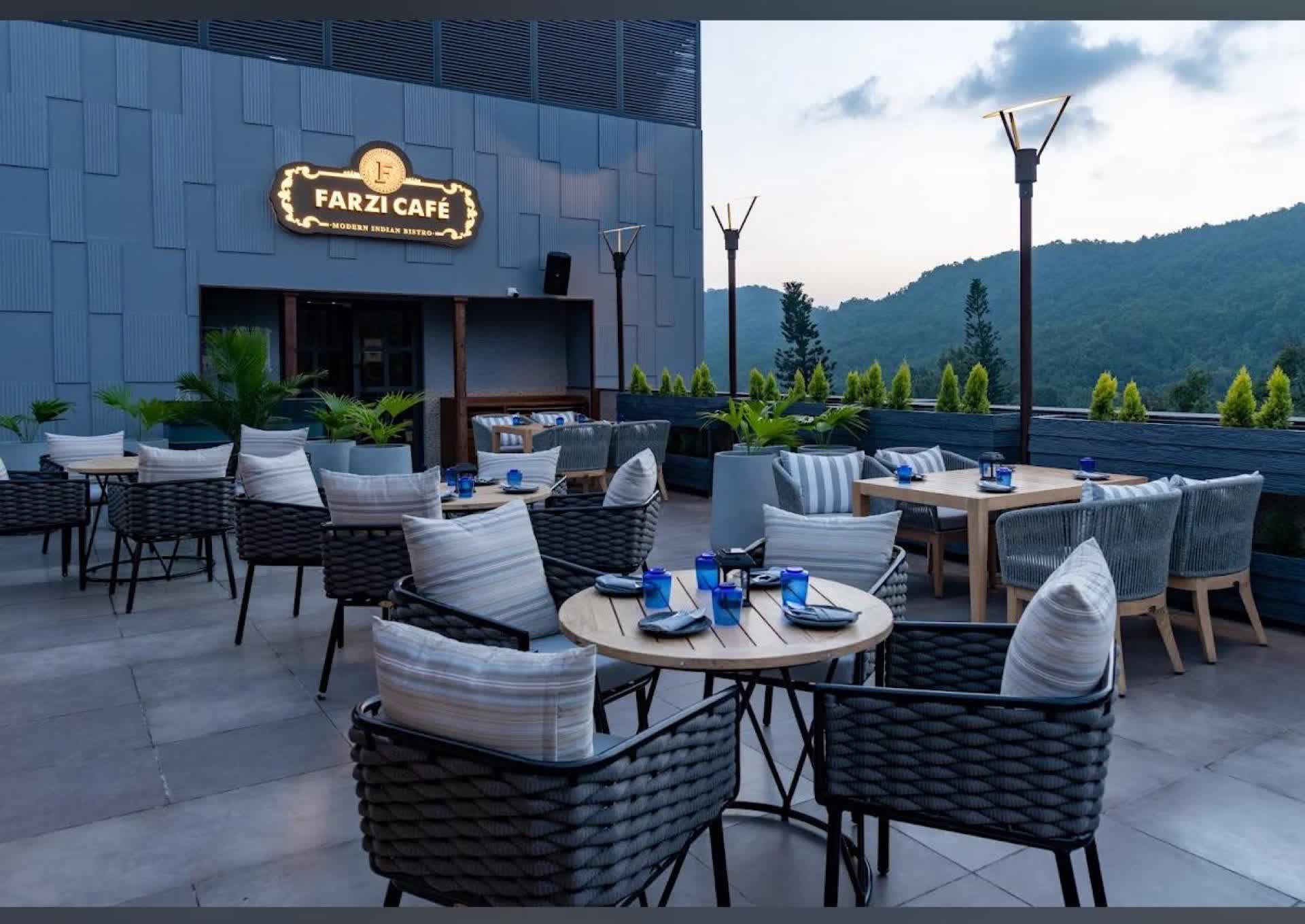 Farzi Café terrace signage at dusk